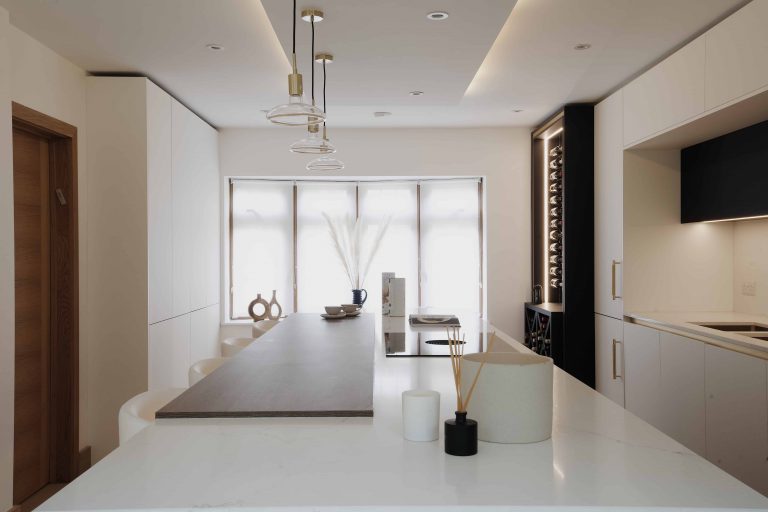 A bespoke kitchen with a marble counter top in London.
