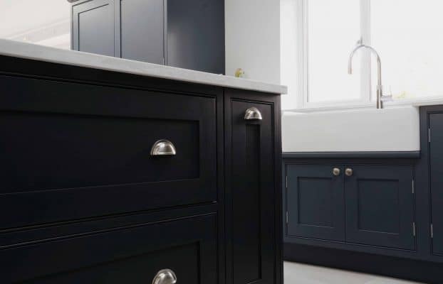 A London kitchen with bespoke black cabinets and a skylight.